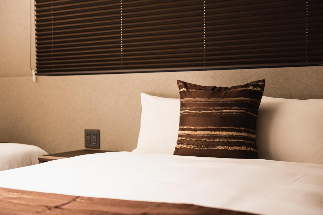 Grand Base Beppu Ekihigashi Aparthotel Bagian luar foto