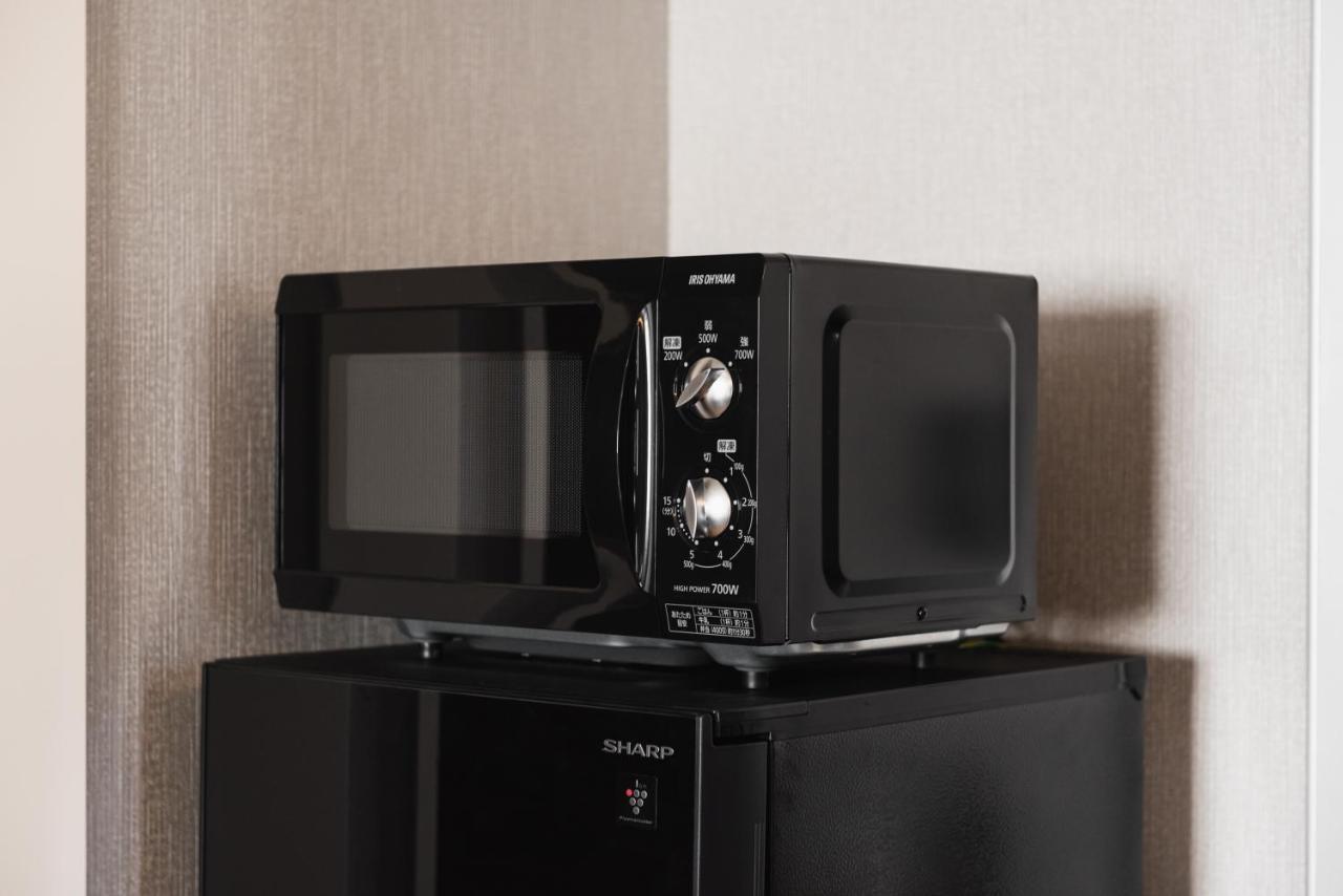 Grand Base Beppu Ekihigashi Aparthotel Bagian luar foto