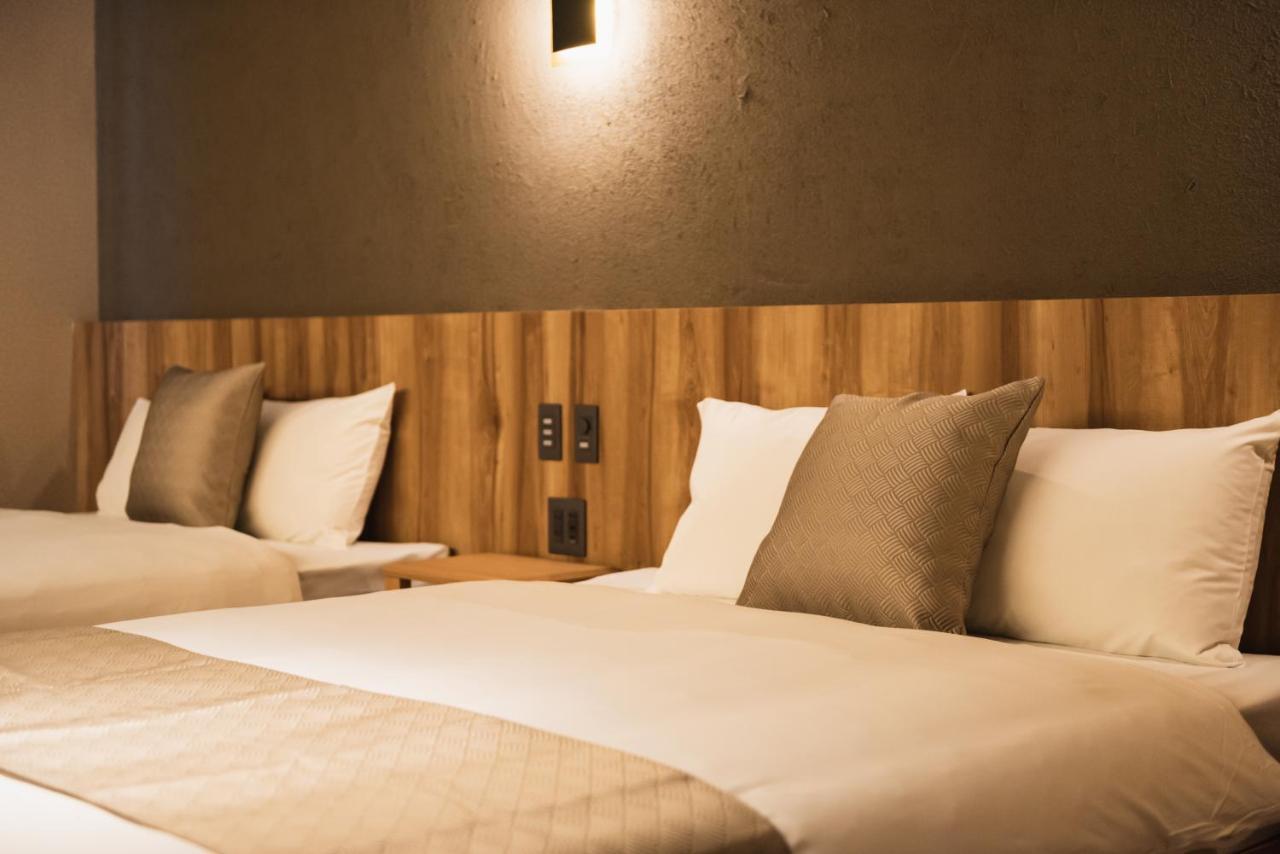 Grand Base Beppu Ekihigashi Aparthotel Bagian luar foto
