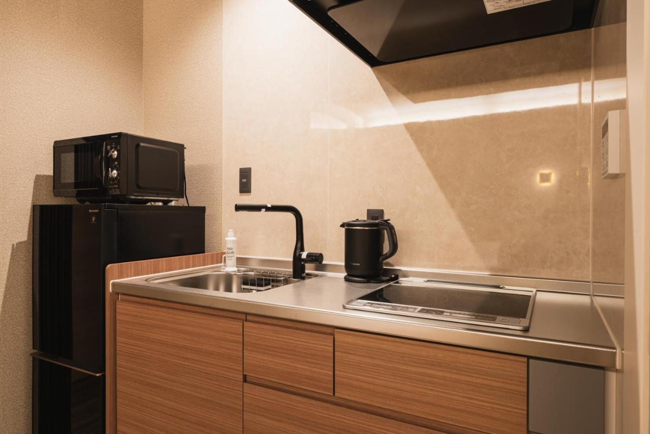 Grand Base Beppu Ekihigashi Aparthotel Bagian luar foto