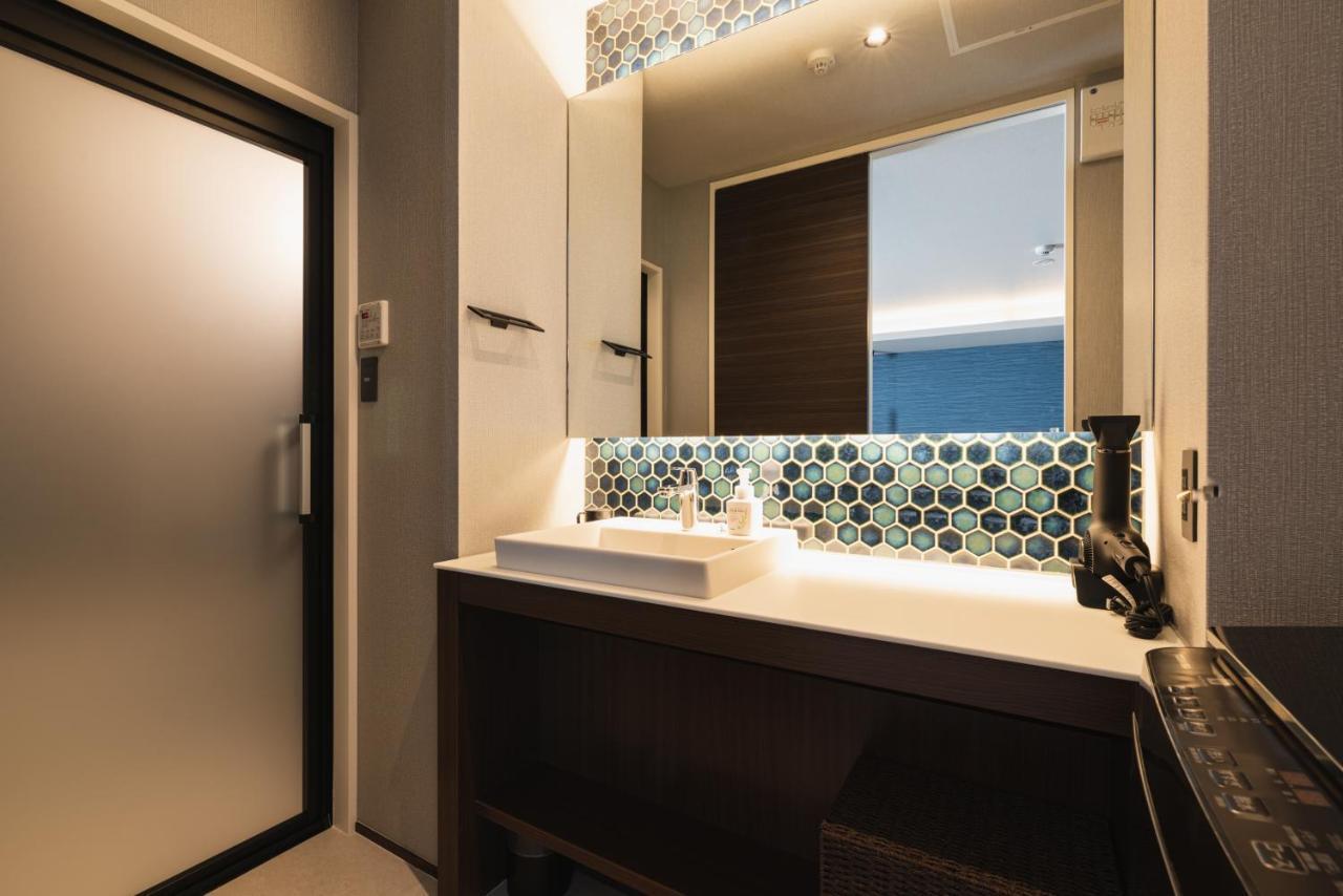 Grand Base Beppu Ekihigashi Aparthotel Bagian luar foto